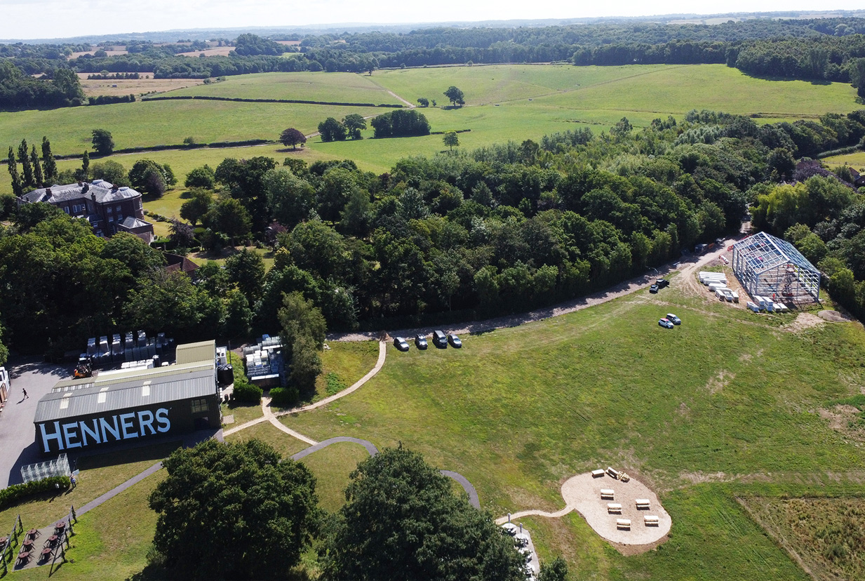 New and existing steel-frame winery buildings taken from the air.
