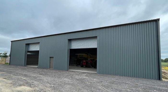 New grain store steel-frame building exterior showing roller shutter doors