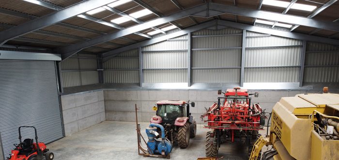 Sussex grain store interior with agricultural machinery