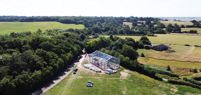 A wide angled view of the steel frame winery building under construction for Henners Vineyard