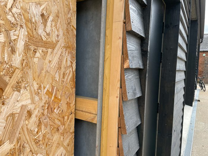 A close-up of sections of the industrial unit with insulation and cladding